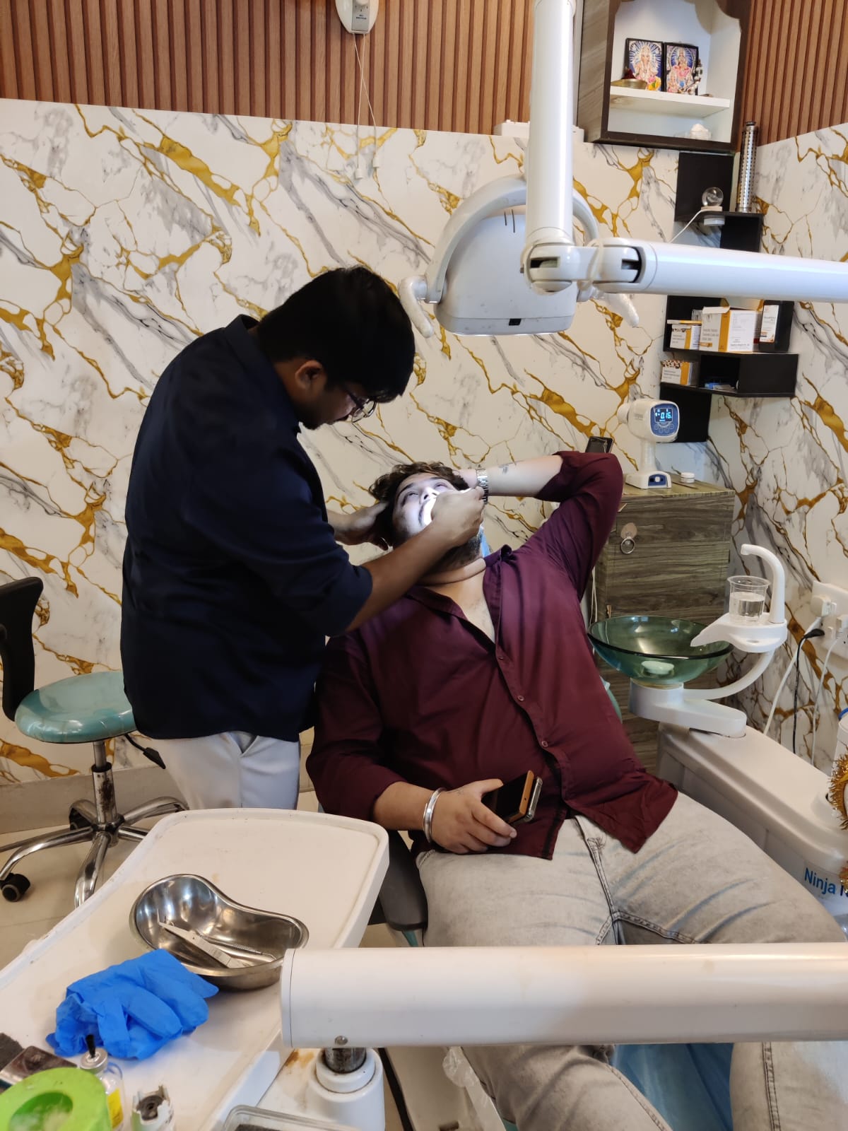 Dentist consulting patient at Empire Dental Clinic